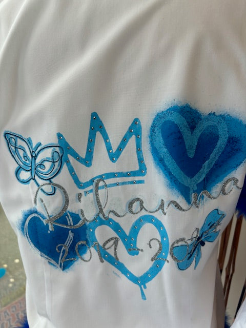 Personalised Glitter; Diamante School Leavers Signing Shirts Blues for Class Year 2025 Children.  A beautiful Keepsake of Memories from the Last Day Of School.  This listing offers a unique personalized glitter and diamante layered design with Diamanté Crown & Heart, Butterflies and Graffiti Hearts, complete with your name and leavers dates. Feel like royalty on your special day with the stunning crown, hearts, and butterflies designs. We offer a range of colour schemes for your shirt.