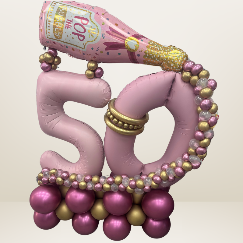 Age 50 themed champagne bottle marquee/stack including champagne balloon bubbles. 