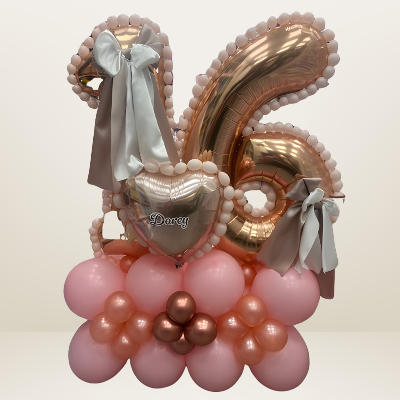 Luxury balloon stack/marquee for a 16 year old with balloon beads, ribbow bow and personalised.