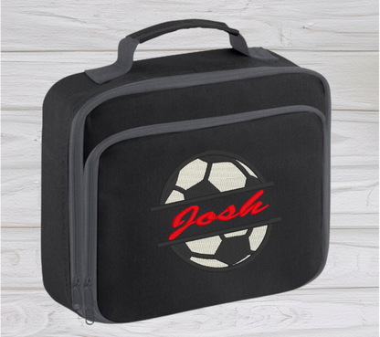 Introducing the ultra-stylish, Personalised Lunch Box Cooler! It's the total package: Zippered front pocket for easy customization. Zippered main compartment. Fully insulated. Wipeable interior. Internal ID label.  Colour - Black Adjustment handle from 7.5cm to 8cm. Reach certified. Dimensions 24 x 20 x 8cm. 3 litres.  Choose between 4 colours - Jet Black, Jungle Camo, Navy Blue, Pretty in Pink!  Personalisation comes complimentary - no extra cost!