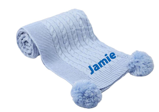 Treat a special little boy to the perfect gift! Our exclusive baby cable knitted pom pom blanket, in stunning Blue, is customised with her name and desired font style and colour. Soft and cuddly, it's ideal for any cot or pram and measures 70 x 100 cm. Make him feel extra special with a personalised embroidered Blue cable knitted blanket!