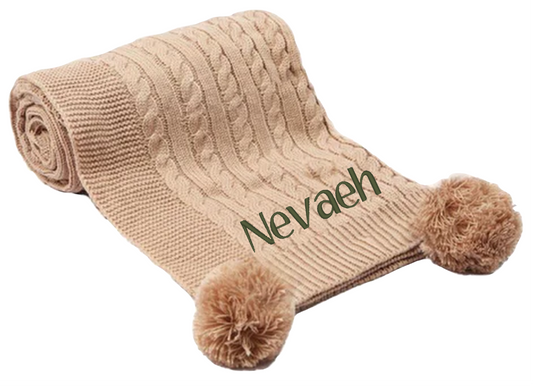Treat a special little boy or girl to the perfect gift! Our exclusive baby cable knitted pom pom blanket, in stunning Coffee Brown, is customised with his or her name and desired font style and colour. Soft and cuddly, it's ideal for any cot or pram and measures 70 x 100 cm. Make him or her feel extra special with a personalised embroidered baby coffee brown cable knitted blanket!