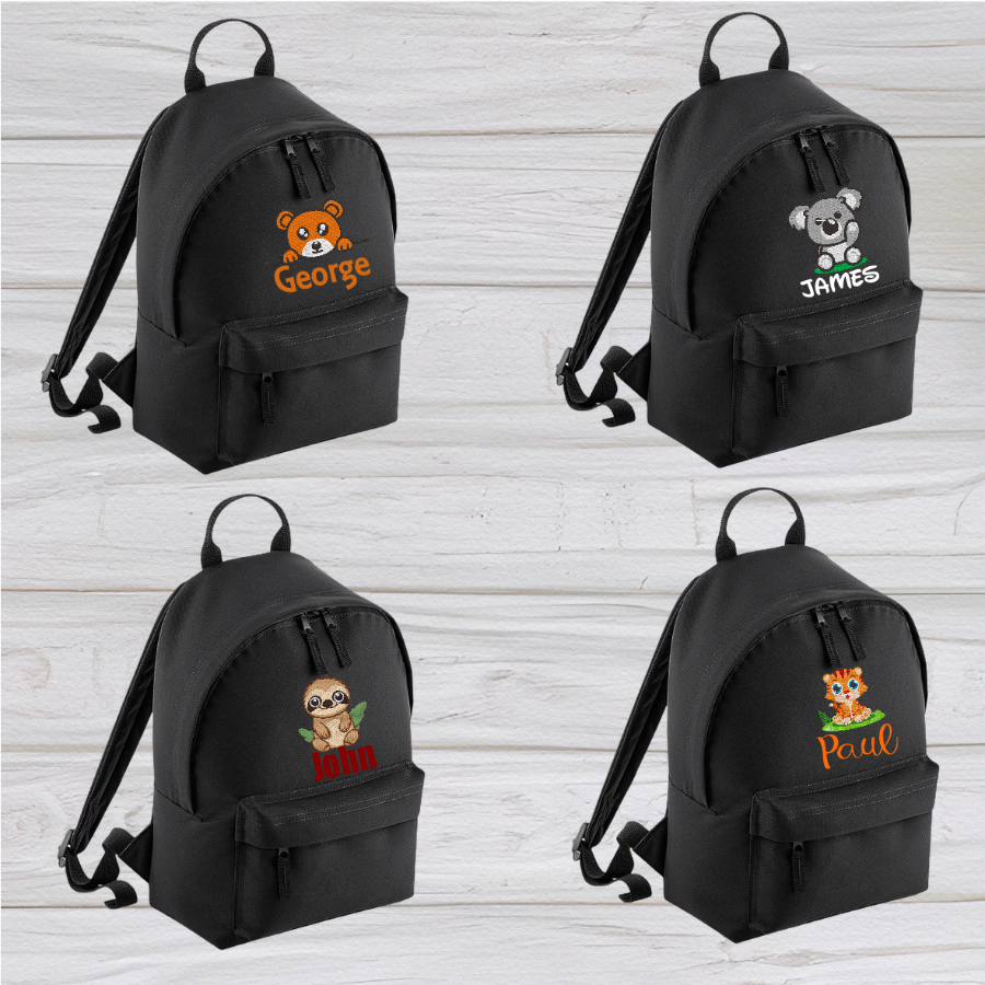 Introducing the fabulously fashionable, petite-sized Personalised Mini School Backpack! It's got it all: a nifty zippered front pocket, extra-cushy back panel and adjustable shoulder straps, plus a handy grab handle to boot!  Colour - Black Rucksack Dimensions - 24 x 33 x 17cm. Capacity 9 litres.  Choose between 4 colours - Jet Black, Jungle Camo, Navy Blue, Pretty in Pink!  Personalisation comes complimentary - no extra cost!