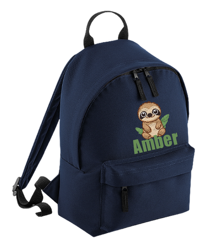 Introducing the fabulously fashionable, petite-sized Personalised Mini School Backpack! It's got it all: a nifty zippered front pocket, extra-cushy back panel and adjustable shoulder straps, plus a handy grab handle to boot!  Colour - Navy Blue Rucksack Dimensions - 24 x 33 x 17cm. Capacity 9 litres.  Choose between 4 colours - Jet Black, Jungle Camo, Navy Blue, Pretty in Pink!  Personalisation comes complimentary - no extra cost!