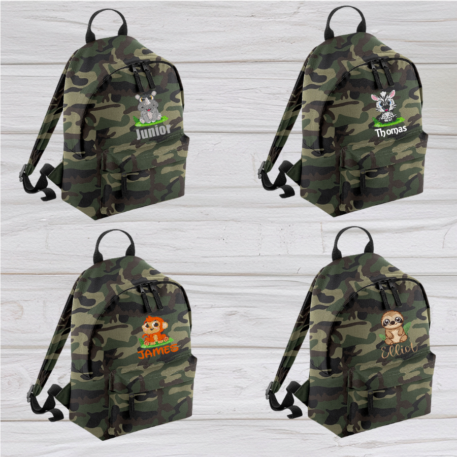 Introducing the fabulously fashionable, petite-sized Personalised Mini School Backpack! It's got it all: a nifty zippered front pocket, extra-cushy back panel and adjustable shoulder straps, plus a handy grab handle to boot!  Colour - Jungle Camo Rucksack Dimensions - 24 x 33 x 17cm. Capacity 9 litres.  Choose between 4 colours - Jet Black, Jungle Camo, Navy Blue, Pretty in Pink!  Personalisation comes complimentary - no extra cost!