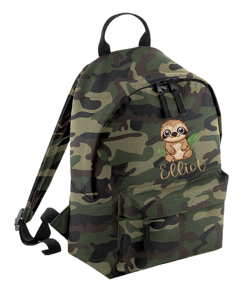 Introducing the fabulously fashionable, petite-sized Personalised Mini School Backpack! It's got it all: a nifty zippered front pocket, extra-cushy back panel and adjustable shoulder straps, plus a handy grab handle to boot!  Colour - Jungle Camo Rucksack Dimensions - 24 x 33 x 17cm. Capacity 9 litres.  Choose between 4 colours - Jet Black, Jungle Camo, Navy Blue, Pretty in Pink!  Personalisation comes complimentary - no extra cost!