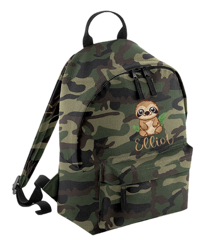 Introducing the fabulously fashionable, petite-sized Personalised Mini School Backpack! It's got it all: a nifty zippered front pocket, extra-cushy back panel and adjustable shoulder straps, plus a handy grab handle to boot!  Colour - Jungle Camo Rucksack Dimensions - 24 x 33 x 17cm. Capacity 9 litres.  Choose between 4 colours - Jet Black, Jungle Camo, Navy Blue, Pretty in Pink!  Personalisation comes complimentary - no extra cost!