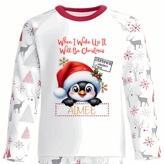 Celebrate the magic of Christmas Eve in these snug personalised pyjamas, featuring a cute Peeking Christmas Penguin Design. With the cheerful phrase “When I Wake Up It Will Be Christmas,” they capture the excitement of the countdown in the coziest, most delightful way.