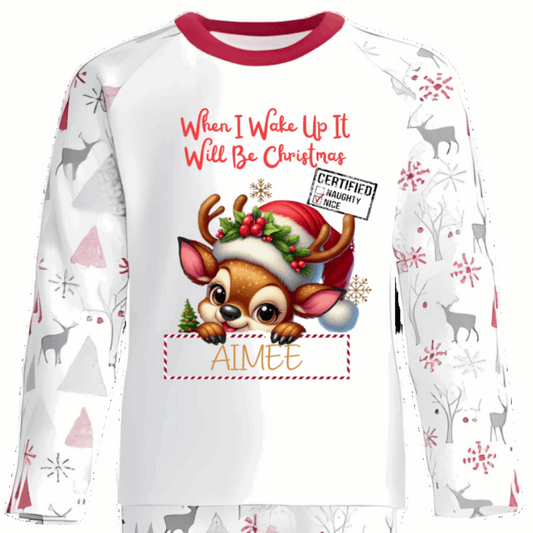 Celebrate the magic of Christmas Eve in these snug personalised pyjamas, featuring a cute Peeking Christmas Reindeer Design. With the cheerful phrase “When I Wake Up It Will Be Christmas,” they capture the excitement of the countdown in the coziest, most delightful way.
