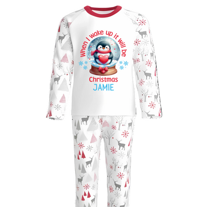 Bring the magic of Christmas Eve to life with our luxury personalised pyjamas, beautifully designed with festive Penguin &amp; Christmas Snow Globe details. Featuring the joyful phrase “When I Wake Up It Will Be Christmas”, these pyjamas capture the excitement of the night before Christmas in the cosiest way possible.