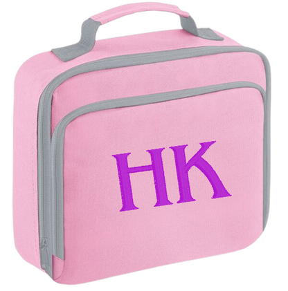 Introducing the ultra-stylish, Personalised embroidery Lunch Box Cooler! It's the total package: Zippered front pocket for easy customization. Zippered main compartment. Fully insulated. Wipeable interior. Internal ID label.  Colour - Pink Adjustment handle from 7.5cm to 8cm. Reach certified.  Choose between 4 colours - Jet Black, Jungle Camo, Navy Blue, Pretty in Pink!  Rucksack Dimensions 24 x 20 x 8cm. 3 litres.  Personalisation embroidery comes complimentary - no extra cost!