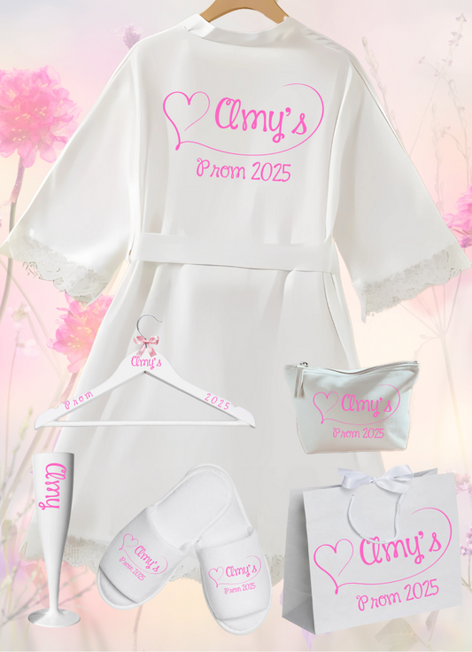 Step into a world of elegance with the perfect personalised Prom lace robe and accessories, including Hangers, Make Up Bags, Wine Flute, Spa Slippers, Gift Bag. Crafted from a stunning combination of delicate lace and luxurious satin, this robe is the epitome of sophistication and comfort.