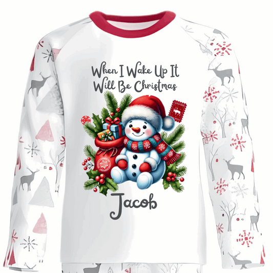 Celebrate the magic of Christmas Eve in these snug personalised pyjamas, featuring a cute Sitting Snowman and a festive Gift Bag. With the cheerful phrase “When I Wake Up It Will Be Christmas,” they capture the excitement of the countdown in the coziest, most delightful way.