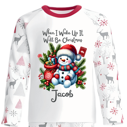 Celebrate the magic of Christmas Eve in these snug personalised pyjamas, featuring a cute Sitting Snowman and a festive Gift Bag. With the cheerful phrase “When I Wake Up It Will Be Christmas,” they capture the excitement of the countdown in the coziest, most delightful way.