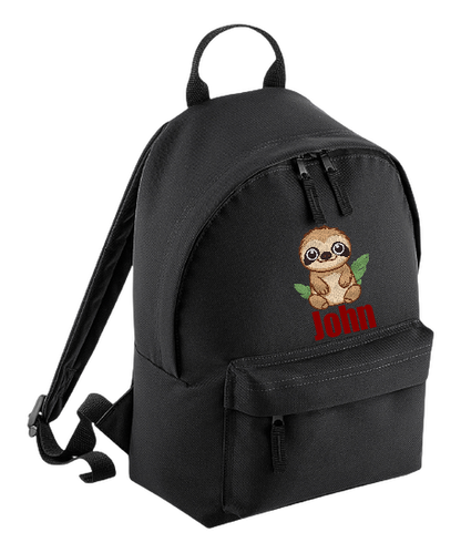 Introducing the fabulously fashionable, petite-sized Personalised Mini School Backpack! It's got it all: a nifty zippered front pocket, extra-cushy back panel and adjustable shoulder straps, plus a handy grab handle to boot!  Colour - Black Rucksack Dimensions - 24 x 33 x 17cm. Capacity 9 litres.  Choose between 4 colours - Jet Black, Jungle Camo, Navy Blue, Pretty in Pink!  Personalisation comes complimentary - no extra cost!