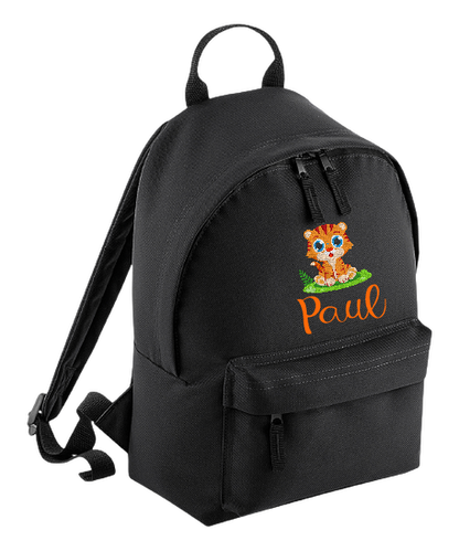Introducing the fabulously fashionable, petite-sized Personalised Mini School Backpack! It's got it all: a nifty zippered front pocket, extra-cushy back panel and adjustable shoulder straps, plus a handy grab handle to boot!  Colour - Black Rucksack Dimensions - 24 x 33 x 17cm. Capacity 9 litres.  Choose between 4 colours - Jet Black, Jungle Camo, Navy Blue, Pretty in Pink!  Personalisation comes complimentary - no extra cost!