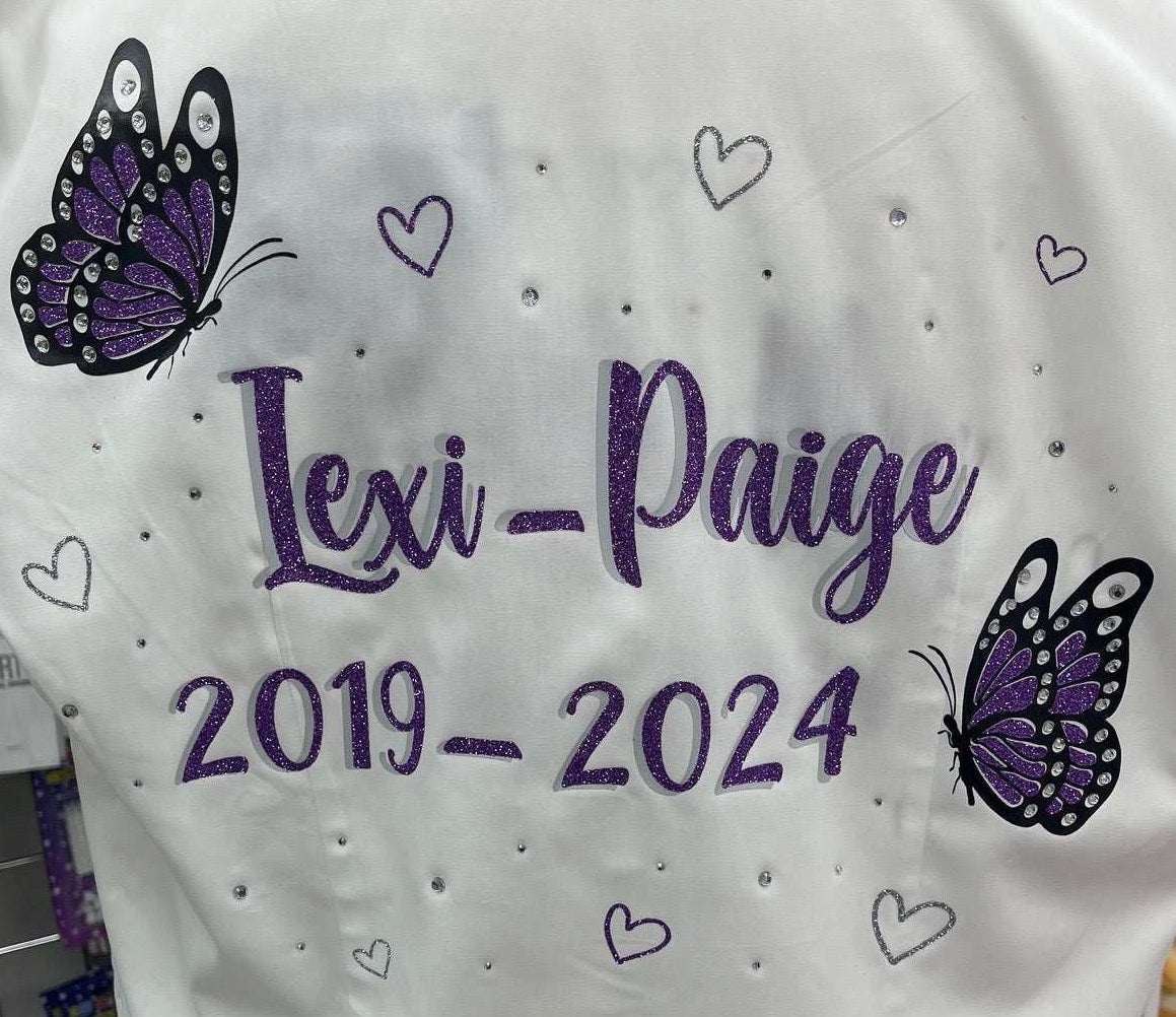 Custom Class of 2026 glitter and diamanté purple butterfly signing shirt with silver glitter hearts, personalized name and dates.