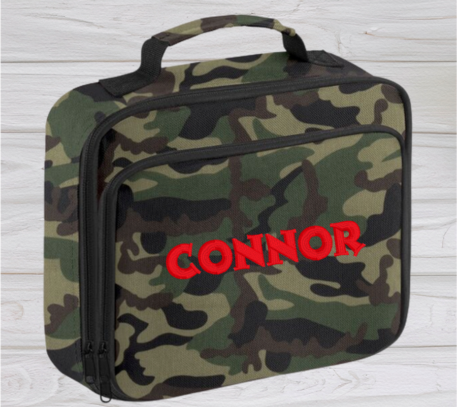 Introducing the ultra-stylish, Personalised Lunch Box Cooler! It's the total package: Zippered front pocket for easy customization. Zippered main compartment. Fully insulated. Wipeable interior. Internal ID label.  Colour - Camouflage Adjustment handle from 7.5cm to 8cm. Reach certified. Dimensions 24 x 20 x 8cm. 3 litres.  Choose between 4 colours - Jet Black, Jungle Camo, Navy Blue, Pretty in Pink!  Personalisation comes complimentary - no extra cost!