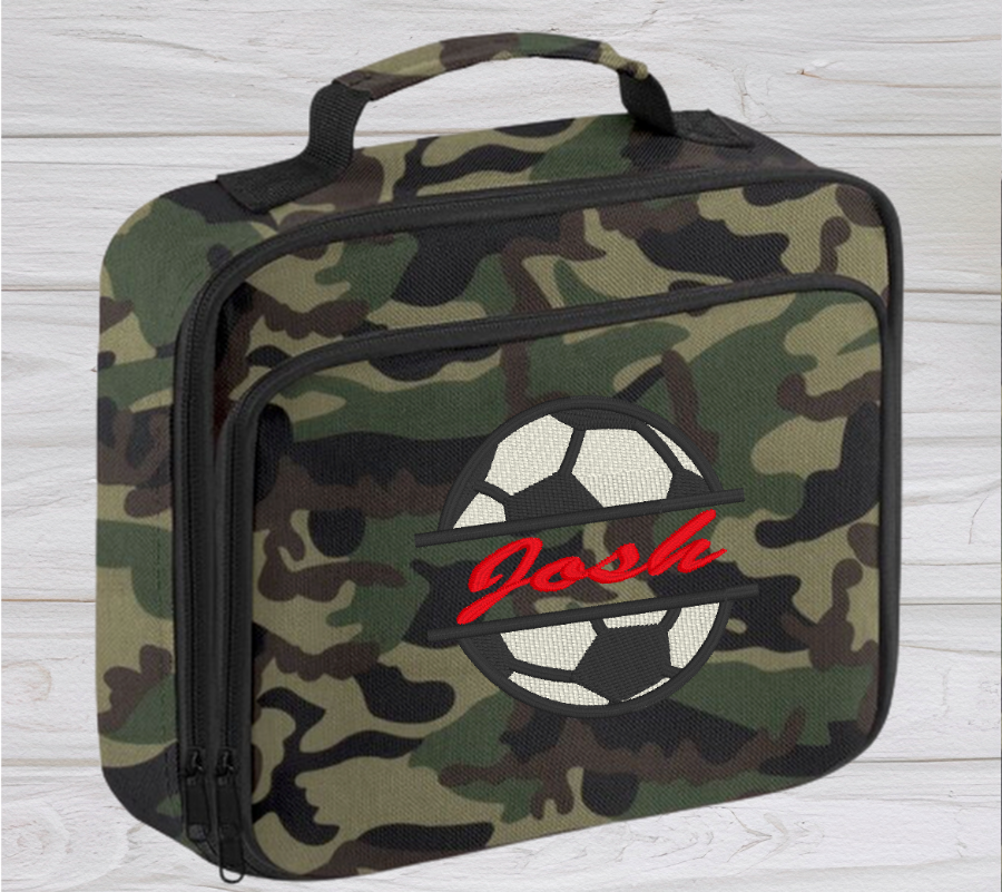 Introducing the ultra-stylish, Personalised Lunch Box Cooler! It's the total package: Zippered front pocket for easy customization. Zippered main compartment. Fully insulated. Wipeable interior. Internal ID label.  Colour - Camouflage Adjustment handle from 7.5cm to 8cm. Reach certified. Dimensions 24 x 20 x 8cm. 3 litres.  Choose between 4 colours - Jet Black, Jungle Camo, Navy Blue, Pretty in Pink!  Personalisation comes complimentary - no extra cost!