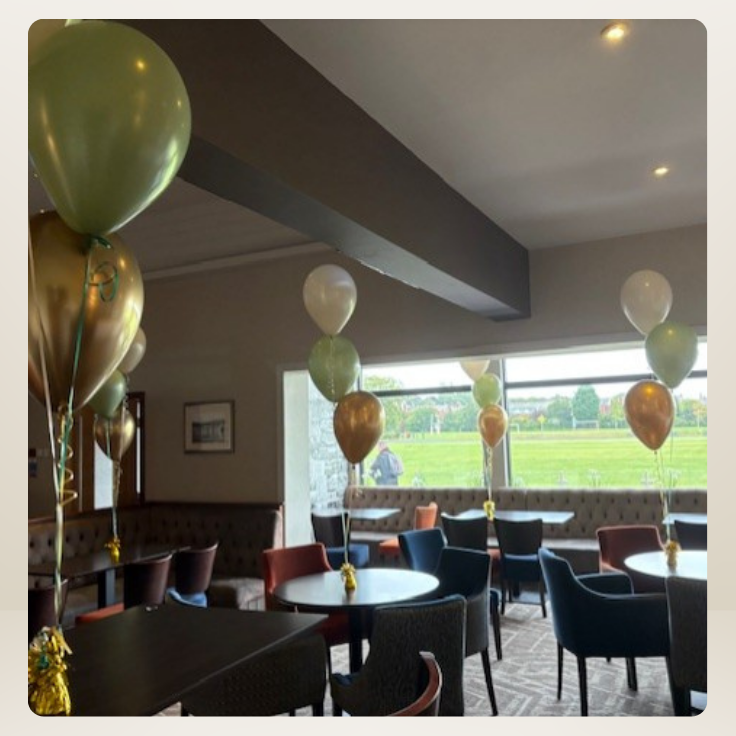 helium balloon clusters on tables at Ruskin Drive, St Helens