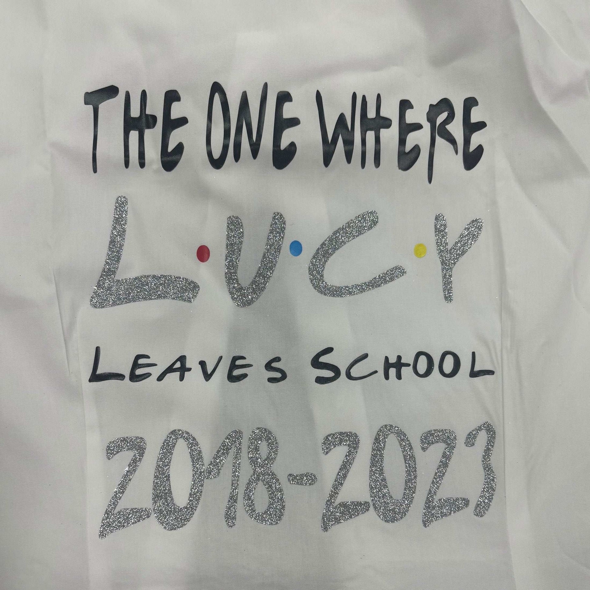 Make your last day of school one for the books with our Personalised Glitter Friends Leavers Signing Shirts for Class of 2025 kids. Capture memories of your amazing time at school with this beautiful keepsake. Our Glitter Friends Themed Design - The One Where Leaves School - is here to make it a fun and colorful farewell. Don't be afraid to shake things up and choose your own colors too (as long as they're available, of course)!