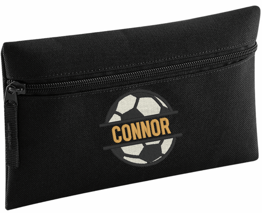 Stay organised in style with our Personalised Pencil Case, perfect for school, home, or work! Choose from a variety of vibrant colours, stylish design, and fun font designs to make it truly your own.

✨ Product Features

Spacious zipped main compartment – ideal for pens, pencils, markers, and more
Internal identification label – so it never gets lost
Customise with name&nbsp;and choice of font and football monogram design.
Choice of 8 colours. Durable, lightweight, and made for everyday use

🎨 Whether you'