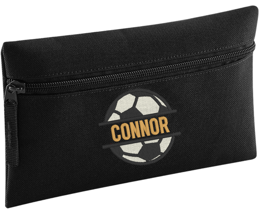 Stay organised in style with our Personalised Pencil Case, perfect for school, home, or work! Choose from a variety of vibrant colours, stylish design, and fun font designs to make it truly your own.

✨ Product Features

Spacious zipped main compartment – ideal for pens, pencils, markers, and more
Internal identification label – so it never gets lost
Customise with name&nbsp;and choice of font and football monogram design.
Choice of 8 colours. Durable, lightweight, and made for everyday use

🎨 Whether you'