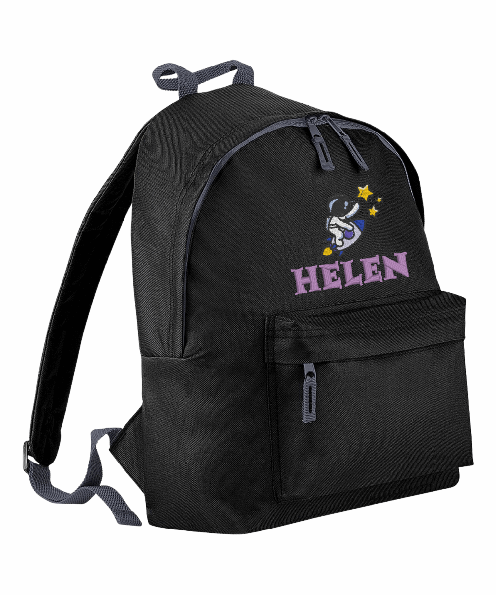 Introducing the fabulously fashionable, junior-sized Personalised Embroidery Junior School Backpack! It's got it all: a nifty zippered front pocket, extra-cushy back panel and adjustable shoulder straps, plus a handy grab handle to boot!

Embroidery Astronaut & Initial design with a choices of font designs and colour.

Choose between 9 colours - Jet Black, Jungle Camo, Navy Blue, Pink, Sky Blue, Purple, Burgundy, Royal Blue & Bottle Green.
