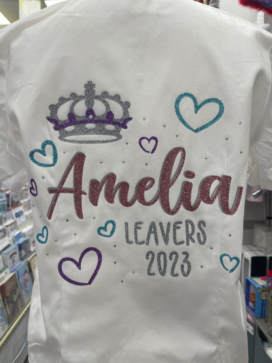 Personalised white leavers shirt with glitter silver and purple crown, glitter blue hearts. School leavers signing shirt idea.