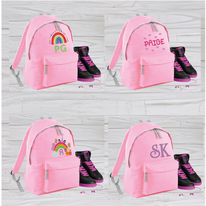 Our personalised Junior Pink School Rucksack Backpack has got it all: a zippered front pocket, comfy padded back panel, adjustable straps for extra support and a handy grab handle. Enjoy your schooldays in style! Going back to school with you very own personalised school bag.  Colour - Pink Rucksack Dimensions 28 x 38 x 19cm. Capacity 12 litres.   (Other colours Burgundy, French Navy, Black, Jungle Camo, Navy Blue, Fuchsia Pink, Purple, Red, Royal Blue, and Surf Blue - take your pick!)