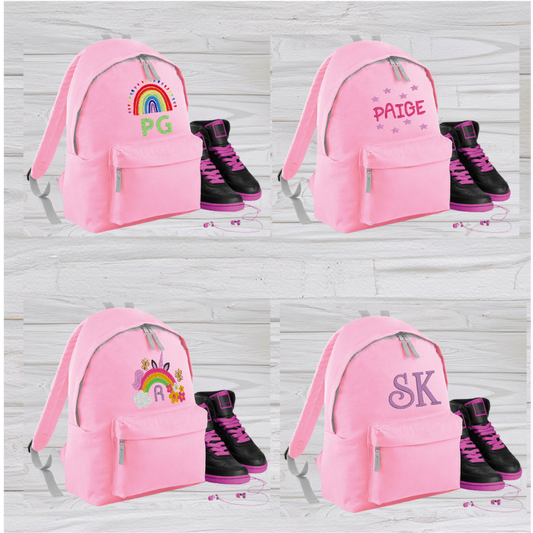 Our personalised Junior Pink School Rucksack Backpack has got it all: a zippered front pocket, comfy padded back panel, adjustable straps for extra support and a handy grab handle. Enjoy your schooldays in style! Going back to school with you very own personalised school bag.  Colour - Pink Rucksack Dimensions 28 x 38 x 19cm. Capacity 12 litres.   (Other colours Burgundy, French Navy, Black, Jungle Camo, Navy Blue, Fuchsia Pink, Purple, Red, Royal Blue, and Surf Blue - take your pick!)