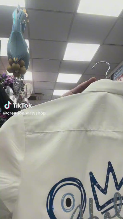 Video of leavers signing shirt with glitter and metallic design evil eyes, hearts and crown