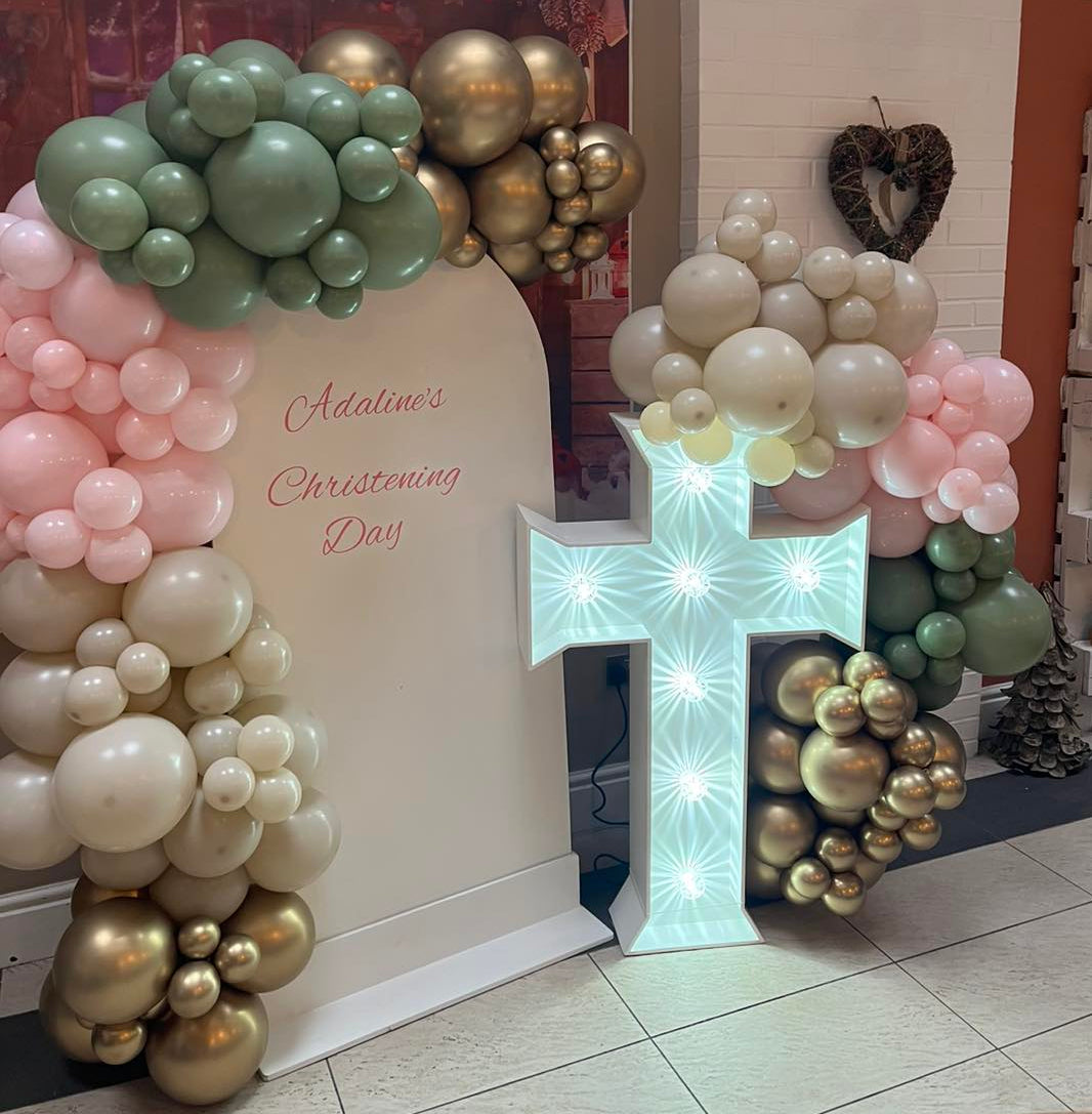 Organic balloon display sail board with light up cross backdrop