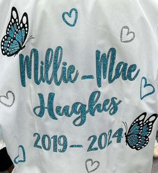 Custom Class of 2026 glitter and diamanté glitter blue butterfly signing shirt with glitter silver and blue hearts, personalized name and dates.