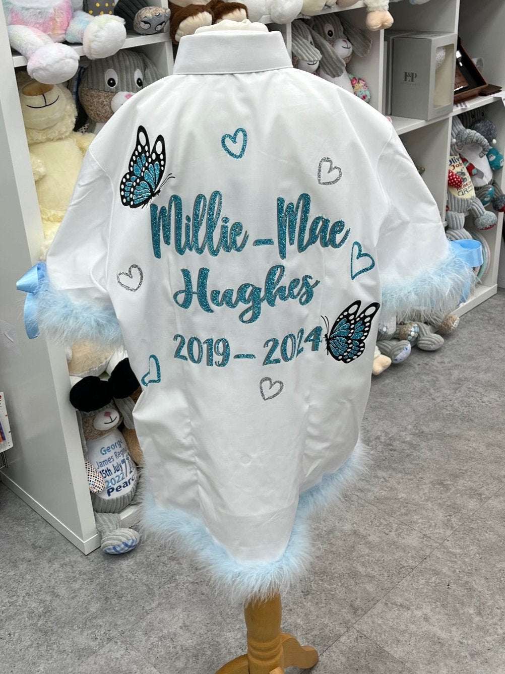 Sprinkle some sparkle onto the end of the school year with these custom Signing Shirts for the Class of 2025! These shirts feature a dazzling Glitter &amp; Diamanté Butterfly Design, complete with glitter hearts and personalized with your name and important dates. The perfect way to remember all the fun and memories of your last day of school.

Enhance your leavers shirt with your own personal touch by adding custom feather trims and bows. Create a truly unique and eye-catching garment that will make a last