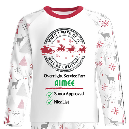 Christmas-themed pyjama set with Santa Claus design on a white background